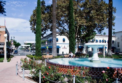 Two children playing in Old Town Orange fountain