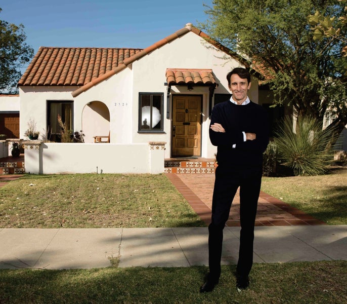 Matthew Fletcher, Orange County Realtor, in front of Floral Park home
